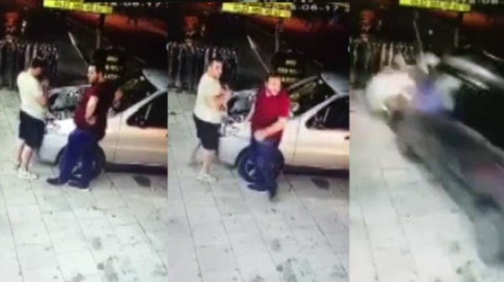 Посетитель и сотрудник стамбульского автосервиса чудом спаслись из-под колес автомобиля (видео)